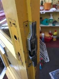 Rebated Union sash lock fitted to yellow wooden door